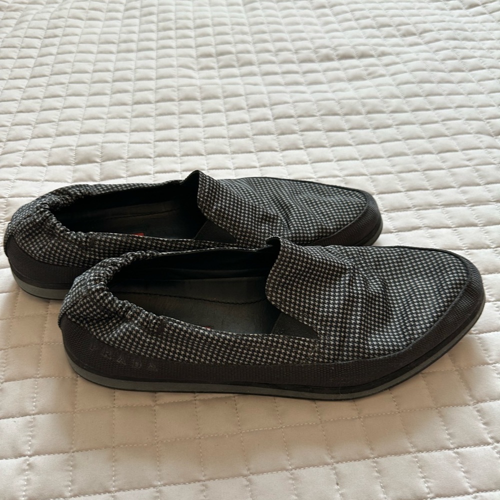 Prada slip-on shoes in a grey and black houndstooth pattern